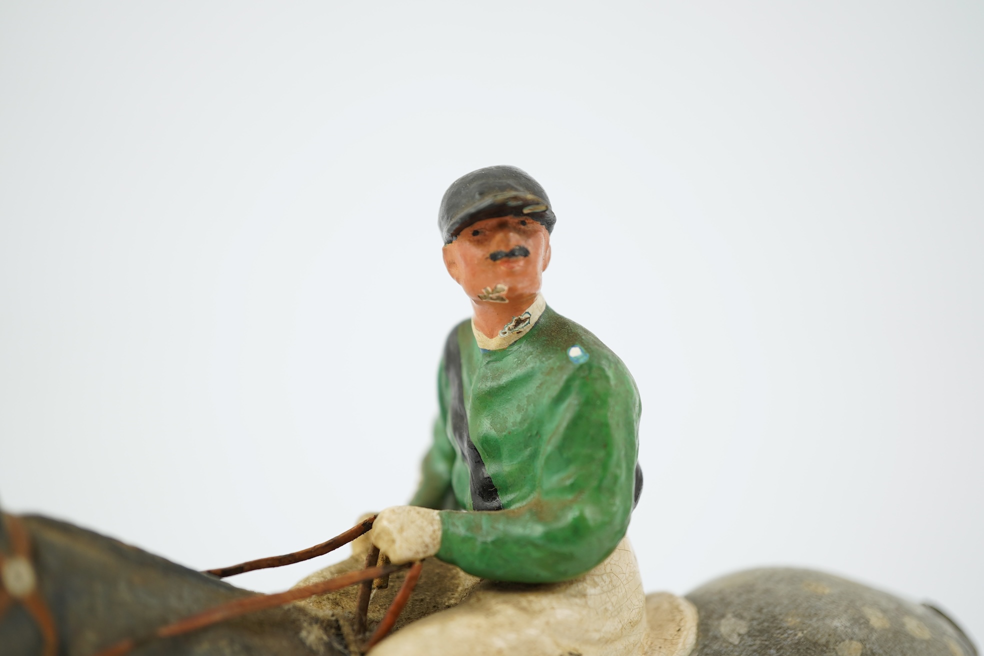 Two Austrian cold-painted bronze figures groups of jockeys on racehorses, early 20th century